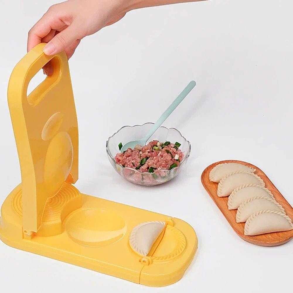 Take the tedious hand-work out of your kitchen with the2-in-1 Dumpling Maker Press. This innovative tool is designed for both beginners and seasoned cooks who want to enjoy homemade dumplings, pierogies, empanadas, or ravioli without the long prep time. Crafted from food-grade, durable materials, the device features a dual-action design: one side serves as a high-pressure manual press to flatten dough balls into uniform skins, while the other side features a folding mold that seals your favorite fillings with a professional decorative crimp. Its ergonomic handle provides maximum leverage with minimal effort, making it a perfect family-friendly tool for holiday meal prep or quick weeknight dinners. Key Responsibilities Dough Flattening:Compresses small dough balls into perfectly round, thin wrappers of uniform thickness.Precision Sealing:Uses a hinged mold to fold and tightly seal the edges of the dumpling, preventing leaks during boiling, steaming, or frying.Decorative Crimping:Automatically creates a traditional "braided" or fluted edge for a professional aesthetic.Workflow Efficiency:Combines two separate kitchen tasks into one station, significantly reducing total preparation time.Safety & Stability:Features a non-slip base and a comfortable grip to ensure safe operation on kitchen countertops.